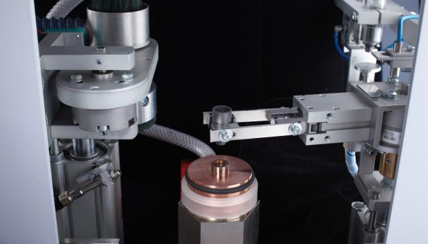 Automated crucible handling with electrode cleaning
